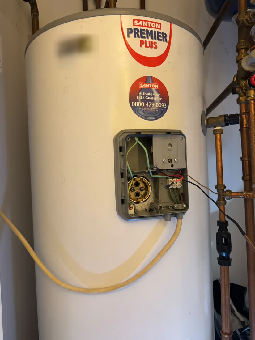 Santon Premier Plus unvented cylinder with the control compartment open during a thermostat and element replacement